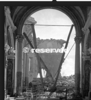 Pietra Colora 1945 Italy Fallen beams form a V shape in the ruins of the church